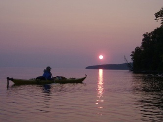 sea kayaking at sunset